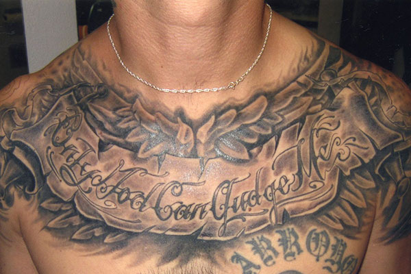 Stomach tattoo saying Only god can judge me