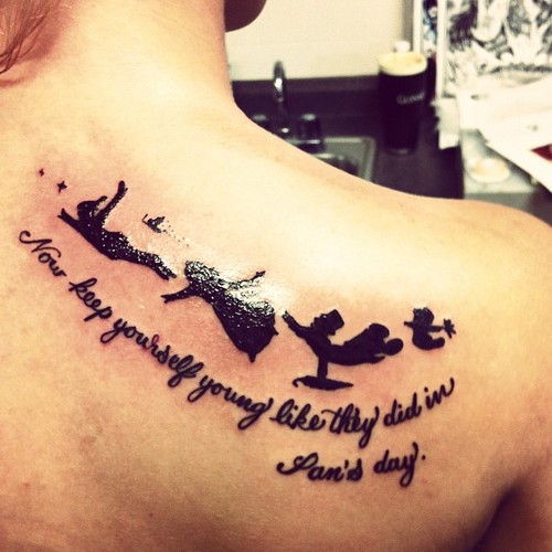 Watercolor Peter Pan tattoo on the left collarbone