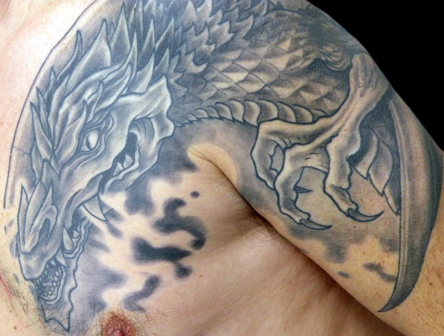 Huge dragon tattoo done on the back
