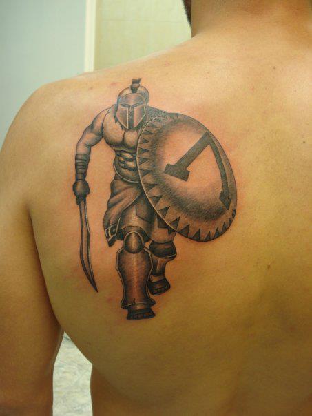 Grey Ink Warrior Greek Tattoo On Right Forearm