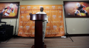 Texas head football coach Charlie Strong talks to the media about his ...