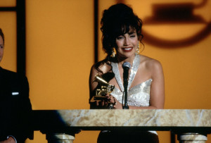 Selena (Jennifer Lopez) accepts a Grammy in sparkling gown.
