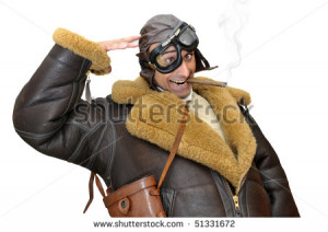 Funny fighter pilot saluting isolated in white