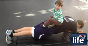 Too cute: Tom Brady continues hard work with his 'little trainer'