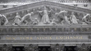 Snow falls outside the New York Stock Exchange during a winter storm ...