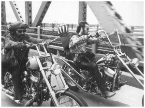... Dennis (Wyatt and Billy in the film) riding over a bridge side by side