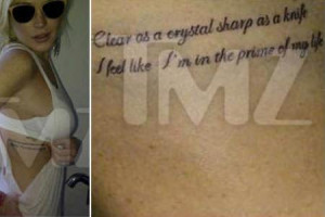 Lindsay Lohan gets new ink & tweets Chris Brown