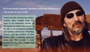 John Trudell, a middle-aged Native American man with a scraggy beard ...