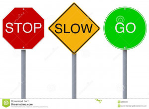 Colorful Stop Slow Go road signs.