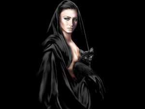 scorpio woman in black with black cat and green eyes