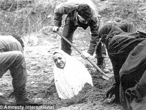 1990s Amnesty International image of a woman being buried before she ...