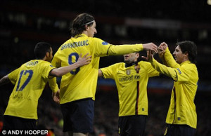 ... : The striker celebrates with Messi (right) after scoring at Arsenal