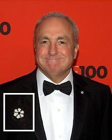Lorne Michaels wearing a Member's lapel pin during a formal event