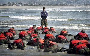 ion_a_Navy_SEAL_instructor_assists_students_from_Basic_Underwater ...