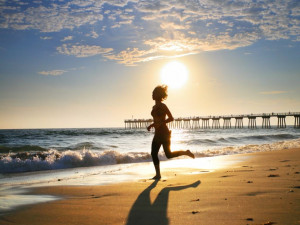 girl running on beach 300x225 girl running on beach
