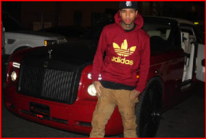 Tyga has to put the top of his car back because it’s too cold to ...