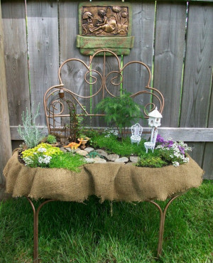 fairy garden out of an old metal chair