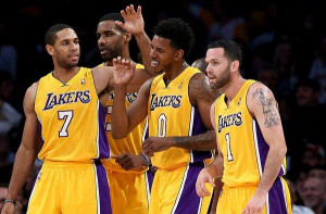 Lakers guard Nick Young (0) is congratulated by teammate Xavier Henry ...