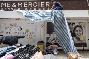police officer removes obstacles at a tram stop during a clearance ...