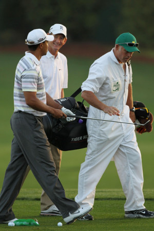 Hank Haney Tiger Woods walks with swing coach Hank Haney and caddie