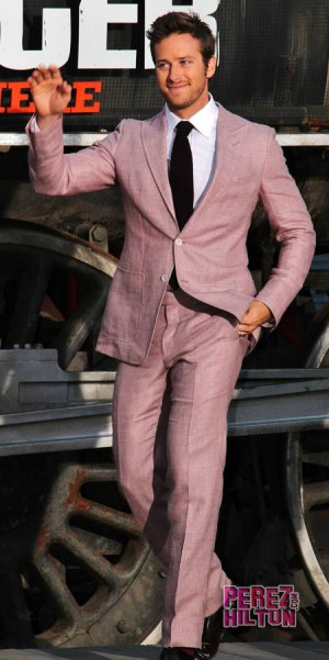 Armie Hammer in soft pink suit.