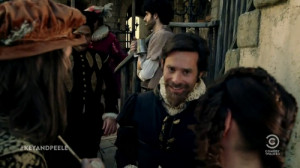 Shakespeare talks to a couple of fans, all charming. (It’s actually ...