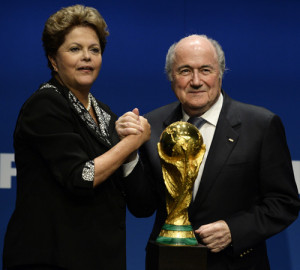 fifa president sepp blatter stands next to the world cup trophy as he ...