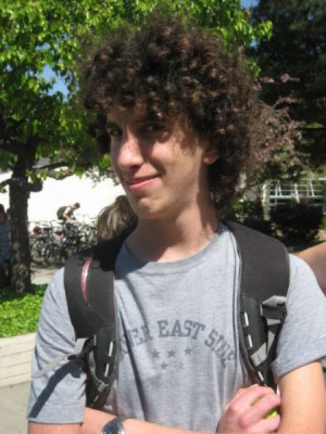 Modern Jewfro Haircut with Curly Hair for Young Boy in Summer