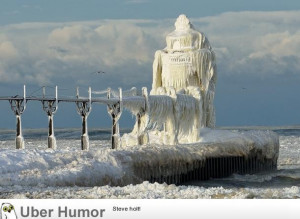 Winter gales on Lake Michigan encase the St. Joseph Lighthouse in ...