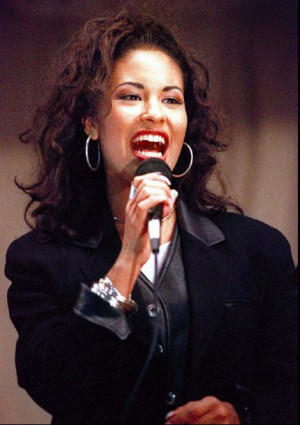vocalist of her family-oriented band Selena y Los Dinos and for her ...