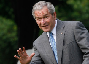 AP President Bush, waving as he leaves the White House on Friday for a ...