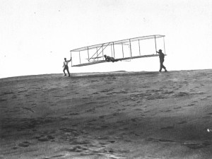 1902 -- Dan Tate chases behind Orville as he flies.