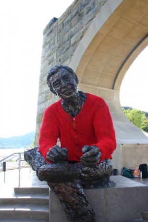 Mister Rogers statue with a yarnbombed zip-up cardigan, ...