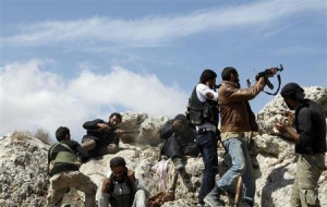Free Syrian Army (FSA) fighters fire their weapons during what the FSA ...