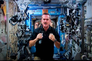 Canadian astronaut Chris Hadfield responds to a question during a news ...