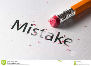 Removing word with pencil's eraser, Erasing mistake.