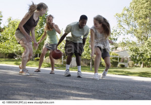 visualphotos.comFriends Playing Basketball