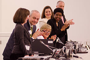 Job Well Done. United Nations officials and guests applaud a speech ...