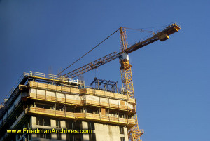 cranehelps construct a high-rise office building.