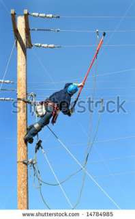an electrical lineman student working on a pole at a lineman college
