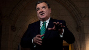 Finance Minister Jim Flaherty takes part in a TV interview on ...