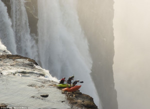 Who is up for it then, chaps? Kayakers paddle up to the precipice of ...