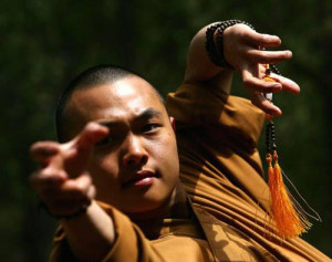... up of one of the monks, he is wearing a mala on his wrist. Shaolin