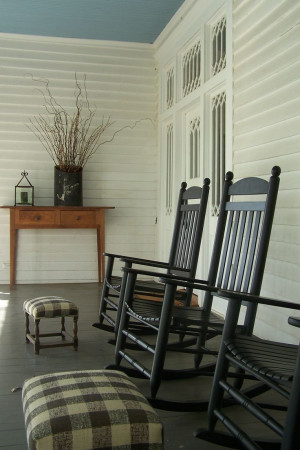 Client porch, long veranda, rocking chairs, foot stools, black and ...