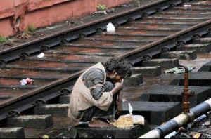 Quotes about Rizq: A poor homeless man eating rice at the railway line ...