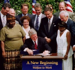 Bill Clinton signs welfare reform.