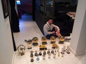 Lionel Messi poses with 27 of his trophies, which includes the 4 ...