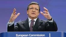 European Commission President Jose Manuel Barroso gestures as he ...