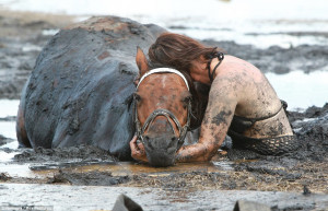 ... her horse's side for THREE HOURS after getting trapped in mud 'like