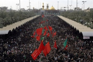 Shiite pilgrims crowd in front of the Imam Hussein shrine during the ...